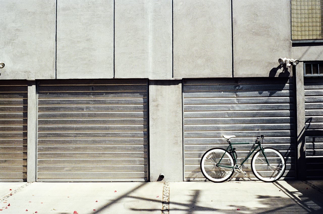 Roller shutters down on a row of garages